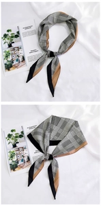 Detail of silk-like neckerchief showing black and white houndstooth pattern and brown borders