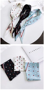 Close-up of silk neckerchiefs with polka dots and striped borders in three colors