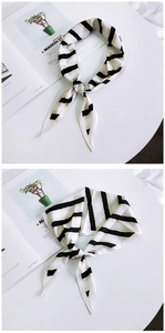 Detail showing the black and white striped diamond silk scarf with pointed ends