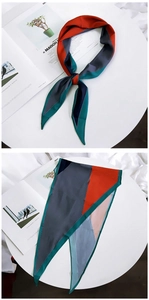 Detail of a geometric color-block silk twilly scarf with satin finish and polka dot edge