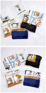 Detail of elegant 70cm silk-feel square scarves featuring classic equestrian horse patterns