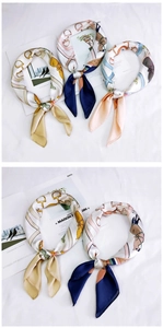 Detail of silk-like satin square scarf with vintage horsebit and stripe pattern