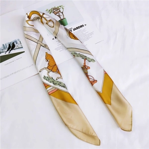 Elegant equestrian horse print twilly silk scarf in yellow and beige on fashion magazine