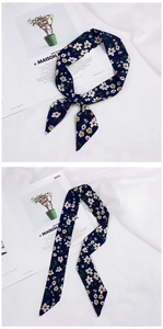 Detailed view of dark blue floral chiffon scarf tied on a handle and spread layout