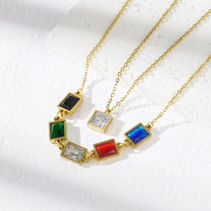 Detailed view of gold stainless steel necklace featuring five colorful rectangular gemstones