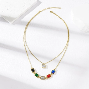 Double-layer stainless steel necklace featuring colorful zircon pendants on white stone