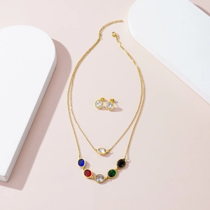 Double-layered gold titanium necklace with multi-colored gemstones and matching stud earrings