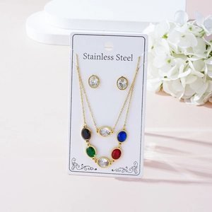 Detail of gold stainless steel necklace and earrings set with colorful zircon gemstones