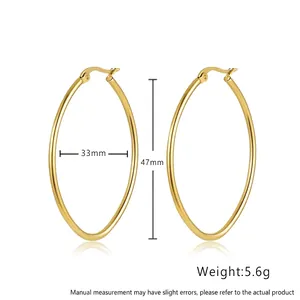 Detail view of large gold oval Mobius earrings with size 47mm x 33mm and weight 5.6g