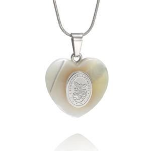 Macro shot of shell heart pendant with Saint Michael engraving on silver snake chain