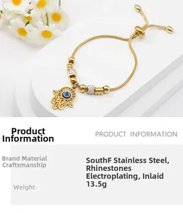 Close-up of gold stainless steel Hamsa bracelet with Evil Eye charm and rhinestones