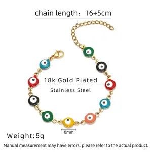 Detail of 18k gold plated stainless steel evil eye bracelet with colorful enamel charms