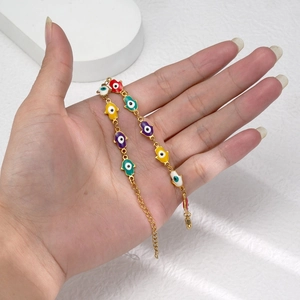 Bracelet main de Hamsa doré avec breloques œil bleu multicolores en acier inoxydable