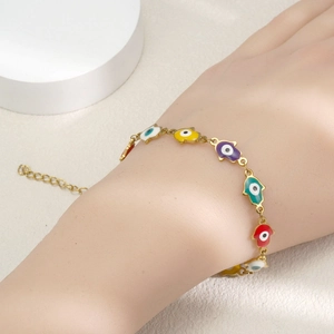 Bracelet main de Hamsa dorée avec breloques en émail coloré et motif mauvais œil