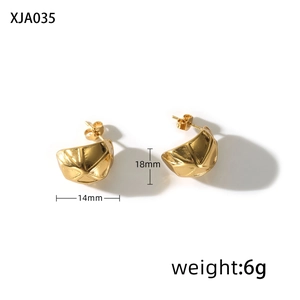 Macro shot of 18mm golden irregular textured pea earrings with 3D geometric cut details