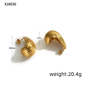 Detailed view of chunky gold striped teardrop earrings with dimensions 32mm by 18mm