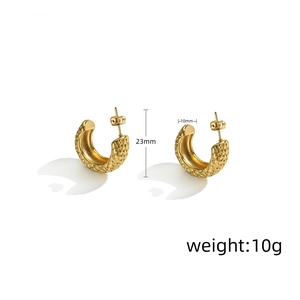 Detailed view of vintage gold stainless steel C-hoop earrings with textured diamond pattern