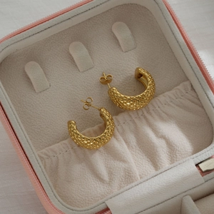 Vintage golden C-shaped stainless steel earrings with quilted pattern texture