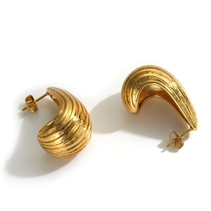 Polished gold chubby C-shape hoop earrings with ribbed texture for women in stainless steel