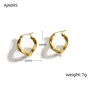 Detail view of gold irregular twisted hoop earrings with dimensions 24mm and 22mm