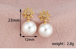 Detailed size view of ship wheel earrings with large pearls and 18k gold plating