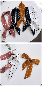 Polka dot silk scarf hair tie collection shown in various colors on flat lay