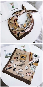 Close-up of vintage coffee cafe print on silky square scarf with cat and menu motifs