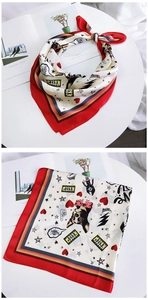 Detail of silk square scarf featuring French Bulldog print and red heart patterns