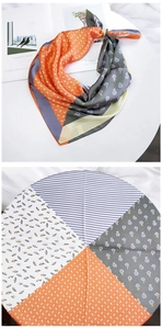 Detail showing mixed pattern silk scarf with floral and geometric patchwork designs