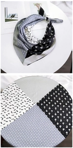 Detail of floral and geometric patchwork square silk scarf with elegant monochrome patterns