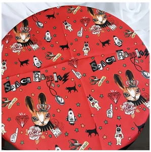 Close-up of red chic square scarf with Space Rabbit and pop-art illustration prints