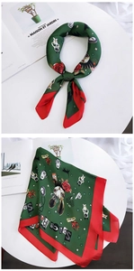 Detail of silk square scarf featuring emerald green base with space and rabbit prints