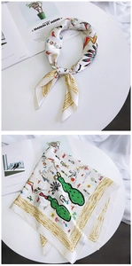 Detail of chic satin square scarf with abstract artistic patterns and smooth texture