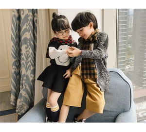 Kids warm plaid scarves in classic checkered patterns for stylish autumn and winter outfits