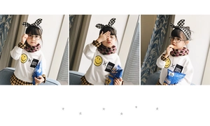 Detail of plaid child scarf with matching headband and smile sweatshirt set