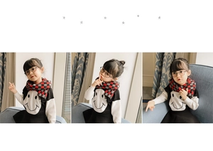 Detail of red and grey checkered knit scarf texture with warm children's winter accessories