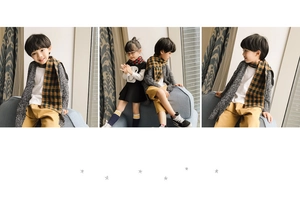 Detail showing red and yellow checkered scarves paired with grey knit cardigans for kids