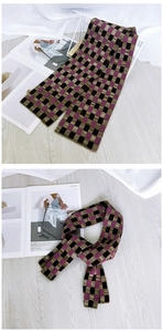 Detail of retro knit checkerboard scarf in purple and green for autumn winter warmth