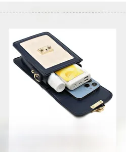 Detail of crossbody phone bag interior showing space for mobile, power bank and lipstick