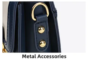 Close-up of high-quality dark blue matte leather with golden hardware and neat stitching