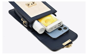 Interior view of small quilted flap crossbody bag showing capacity for phone and power bank