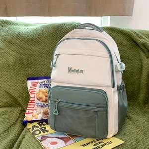 Sac à Dos en Toile Couleur Contrastée pour Femmes Grande Capacité Sac d'École Avec Pendentif en Peluche Multi-Poches Décontracté