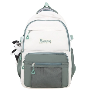 Sac à dos patchwork beige et vert avec plusieurs fermetures éclair et pendentif panda