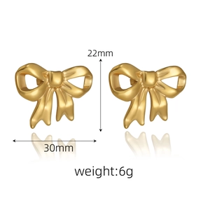 Detailed view showing 30mm x 22mm dimensions and 6g weight of gold bow knot earrings