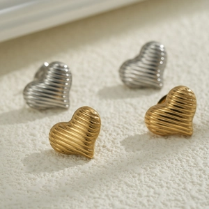 18K gold and silver heart-shaped stainless steel stud earrings with textured surface