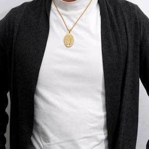 18K gold plated stainless steel religious Guadalupe pendant necklace worn by a model