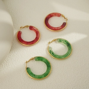 Artistic translucent resin hoop earrings in red and green with gold metal clasps