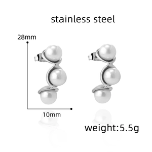 Detail view of 28mm stainless steel S-curve earrings with three white pearls on white background