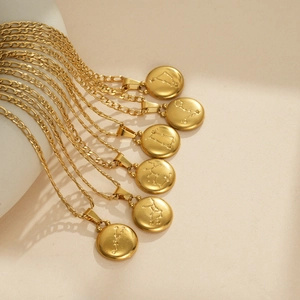Gold stainless steel Figaro chain necklaces with etched zodiac coin pendants