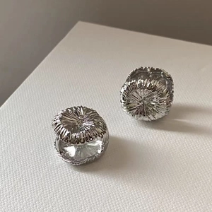 Silver retro round earrings with radial textured fireworks pattern and a metallic finish